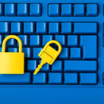 Yellow padlock and key and blue keyboard. Computer